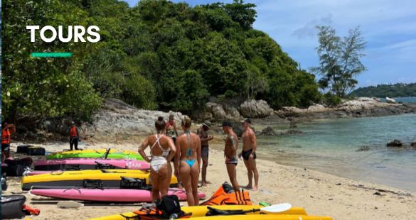 Tours - group of paddlers with KYYAAK kayaks on an island beach