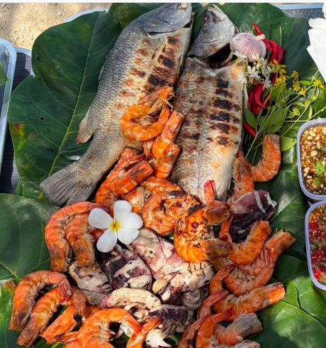 BBQ seafood feast of grilled fish and prawns on the island