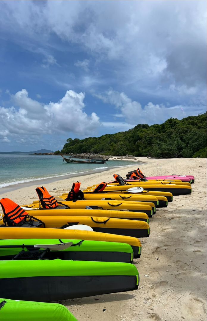 Row of KYYAAK kayaks ready on a Phuket beach