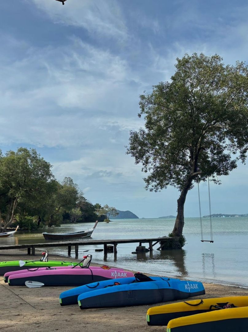 KYYAAK kayaks on a quiet Phuket beach by a jetty