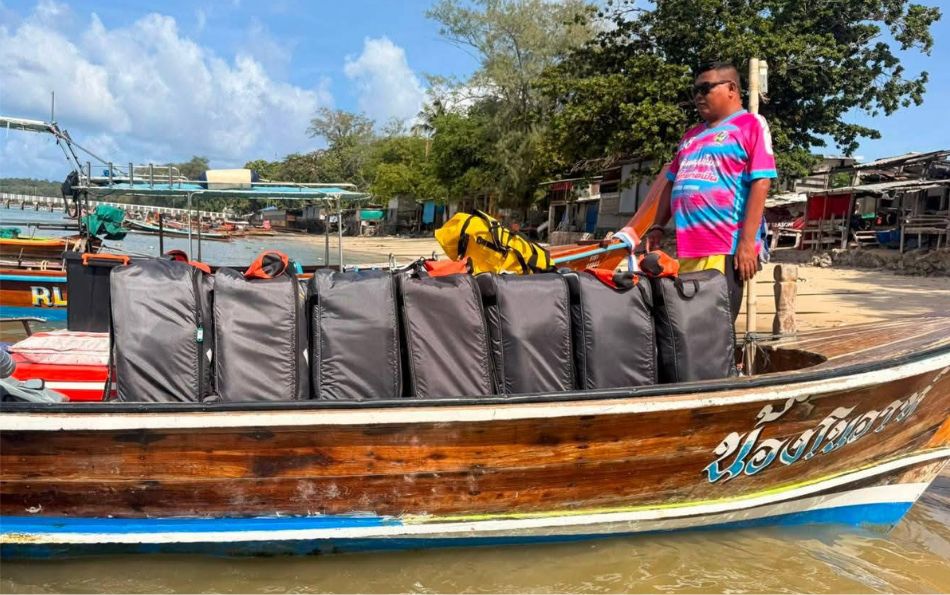KYYAAK kayak bags loaded onto a longtail safety boat