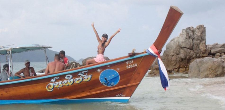 Guest celebrating on a longtail boat
