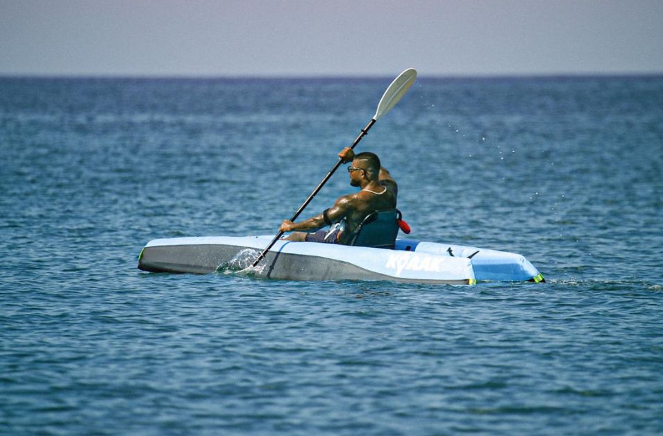 Paddler on a white KYYAAK in open water