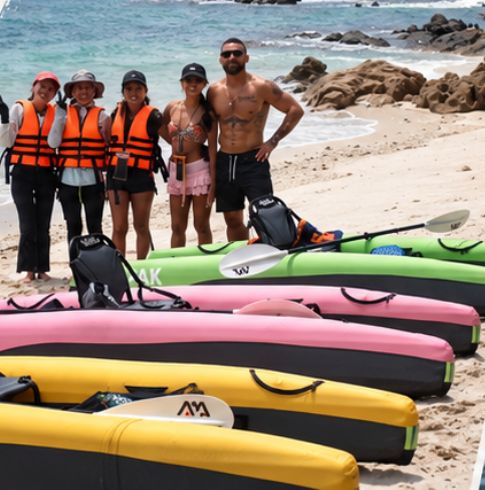 KYYAAK tour group in life jackets on the beach with the operations team